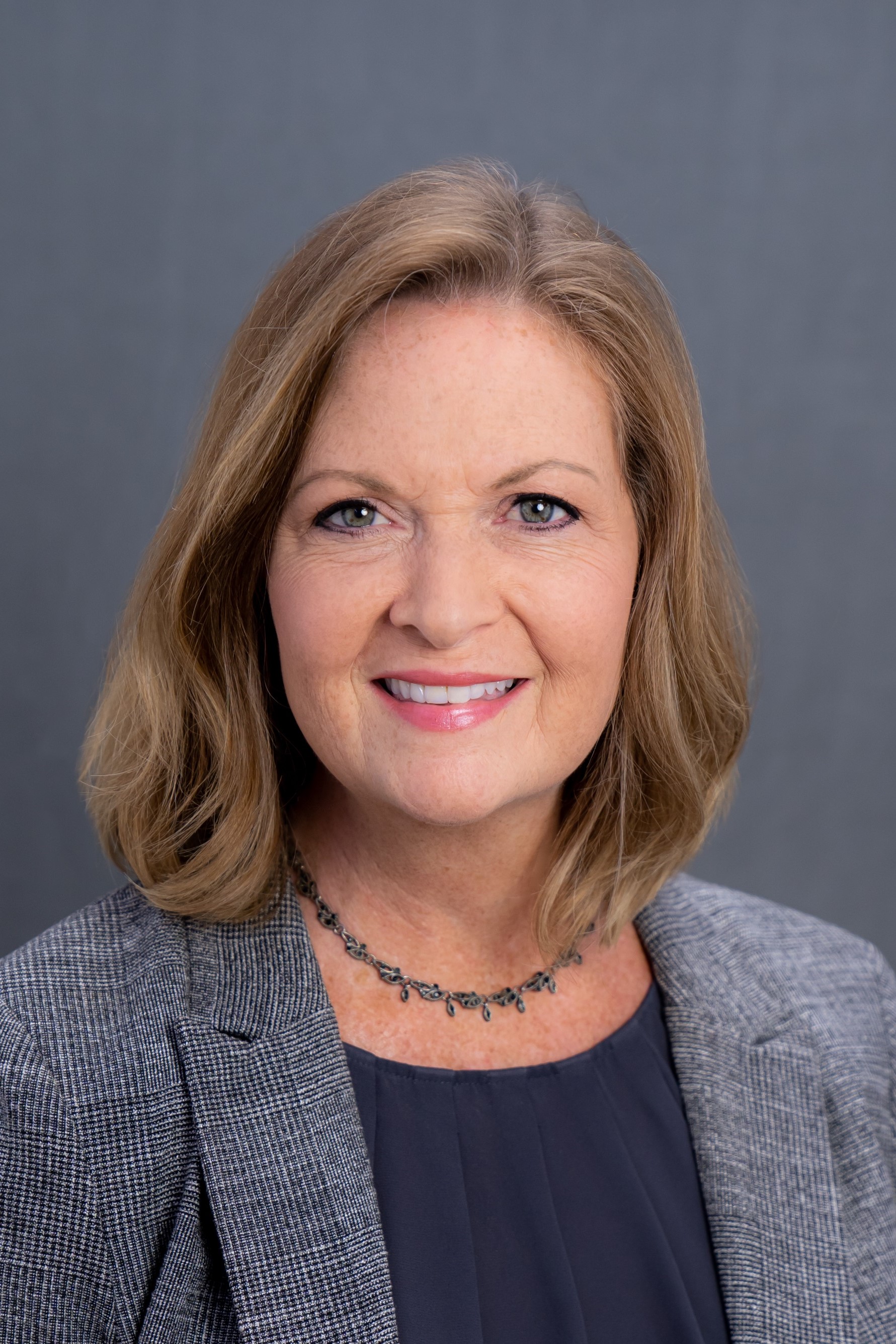 headshot of Martha York in a grey blazer