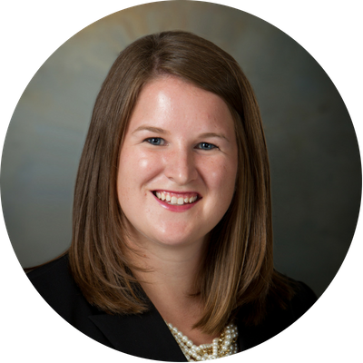 round headshot of Jessica in a black blazer